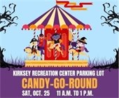 A Halloween-themed merry-go-round with costumed children riding it. Text reads "Kirksey Recreation Center Parking Lot Candy-Go-Round Sat, Oct. 25, 11 to 1 p.m."