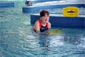 A woman in an indoor pool