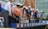 A picture of elected officials scooping dirt during the ceremonial groundbreaking