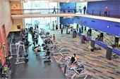Patrons enjoying the Fitness Hub and indoor track.