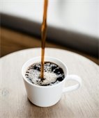 Coffee being poured into a mug.