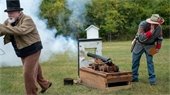 Cannon fire demonstration at Guns N Gowns.