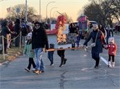 A family walking in a parade