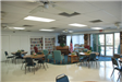 Community room with bookshelves and chairs