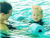 Boy Recieving Swimming Lesson