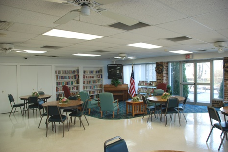 Community room with bookshelves and chairs